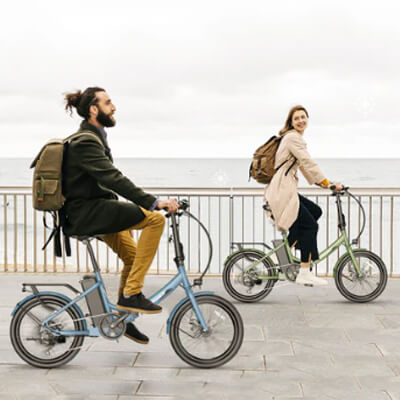 a man and a woman riding on fafrees f20 light e-bikes