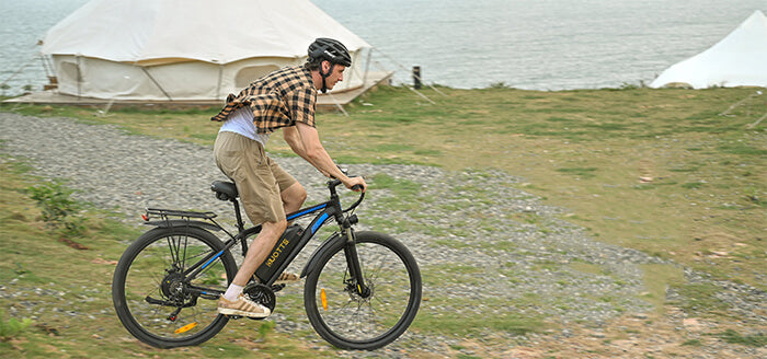 a man rides a duotts ebike