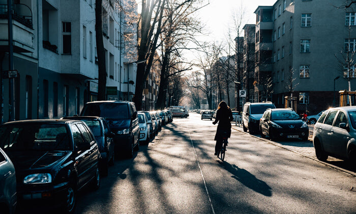 a woman cycling on the road